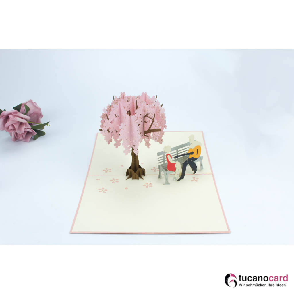 Pärchen beim Date unter Kirschbaum - Kartenfarbe Rosa - 15 x 20 cm
